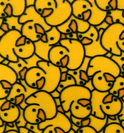 Pattern of yellow cartoon ducks on a yellow background